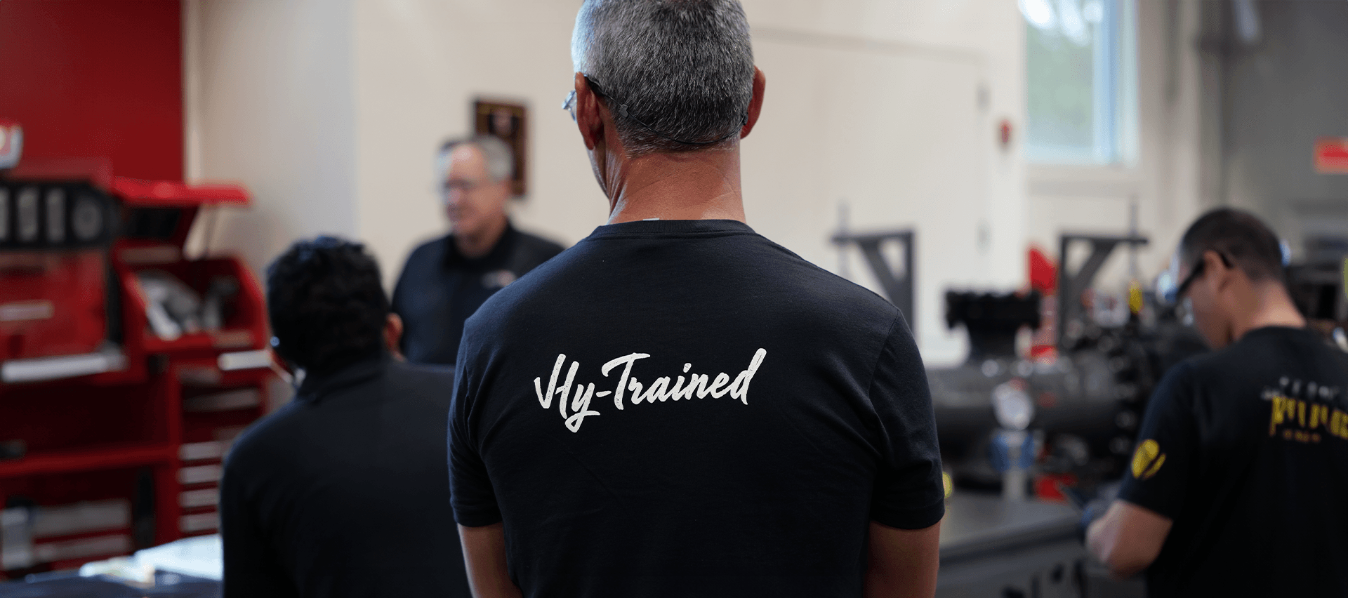 A HYTORC trainee wearing a Hy-Trained shirt during an on-site training session
