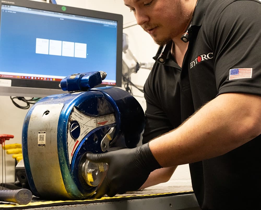 A HYTORC technician calibrating an MXT hydraulic torque wrench