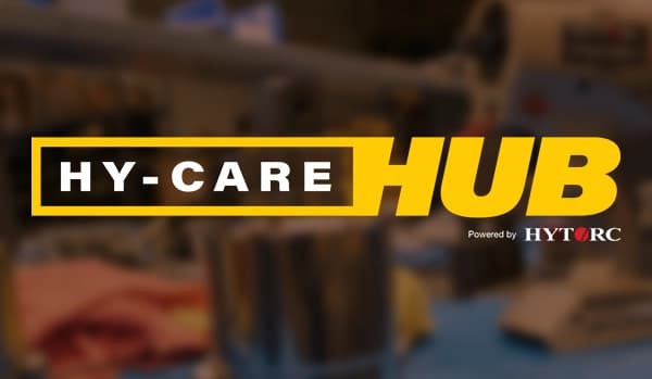 A graphic with the HY-CARE HUB badge including various tools and accessories in the background.