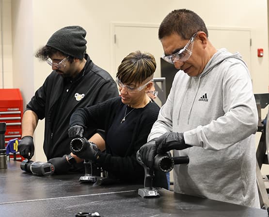 A team of trainees interfacing with HYTORC electric torque tools